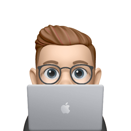 boy peaking behind laptop